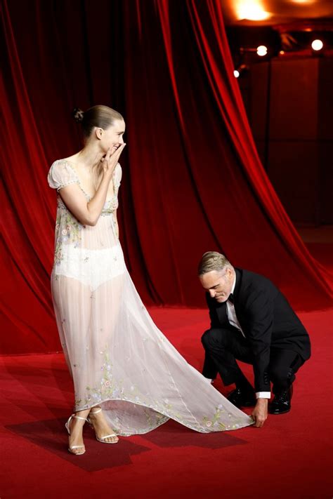 Joaquin Phoenix Fixes Rooney Mara’s Dress in Red Carpet